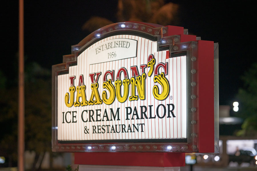 Night photo of Jaxsons Ice Cream Parlor Dania Beach, FL. Huge ice cream scoops & American fare are served at this old-fashioned parlor with memorabilia. 