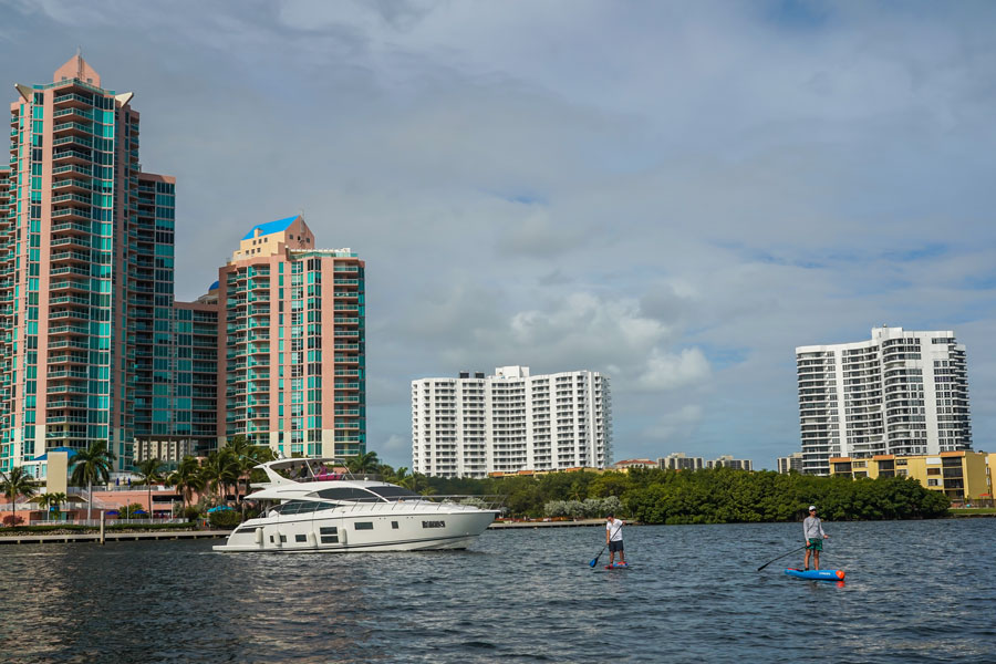 Boats and luxury condominiums in Aventura, Miami, Florida. View from Intracoastal Waterway. January 2, 2021. 