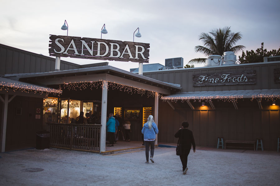 Tourists walking into the Sandbar Restaurant on Holmes Beach on Anna Maria Island, January 14, 2021. 