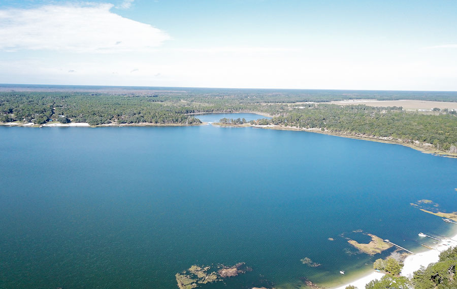 An aerial view of a lake in Keystone Heights Florida taken by flying a drone over the lake.