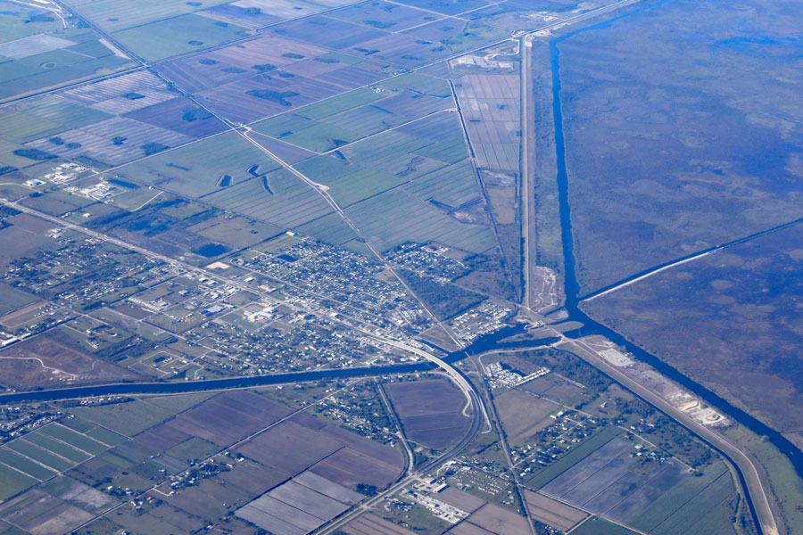 Aerial view of Moore Haven, Florida, near Clewiston, with the Moore Haven Bridge, and the Caloosahatchee Canal, from Lake Okeechobee.